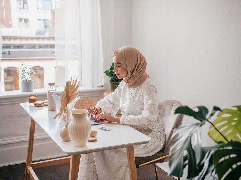 Person working at a bright, ergonomic desk, feeling calm and focused.